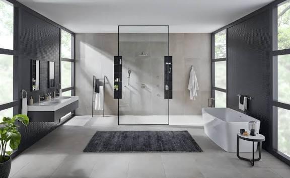 Grohe spa-style bathroom with wood slat wall, freestanding tub, walk-in shower and coastal view