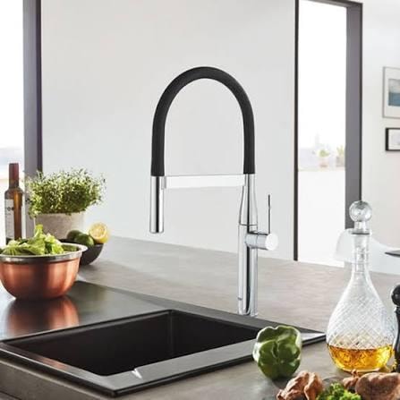 Grohe Minta kitchen faucet with black spring spout over undermount sink