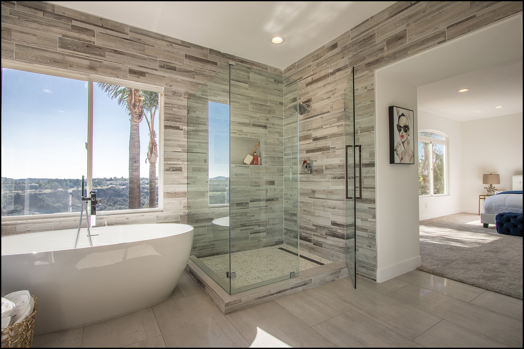 Bathroom remodel in Irvine CA — freestanding soaking tub, large format porcelain tile, and spa-inspired design by Main Street Kitchen & Flooring